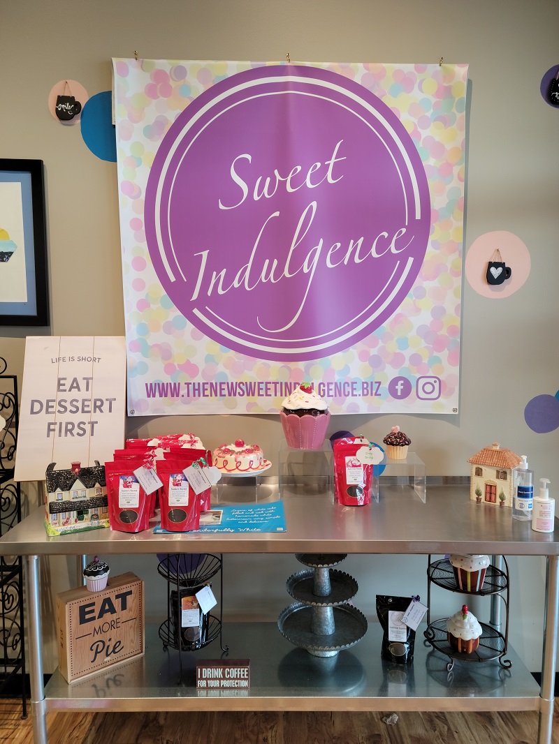 An interior display of The New Sweet Indulgence with a variety of empty displays to show off sweets. Photo by Matthew Macomber.