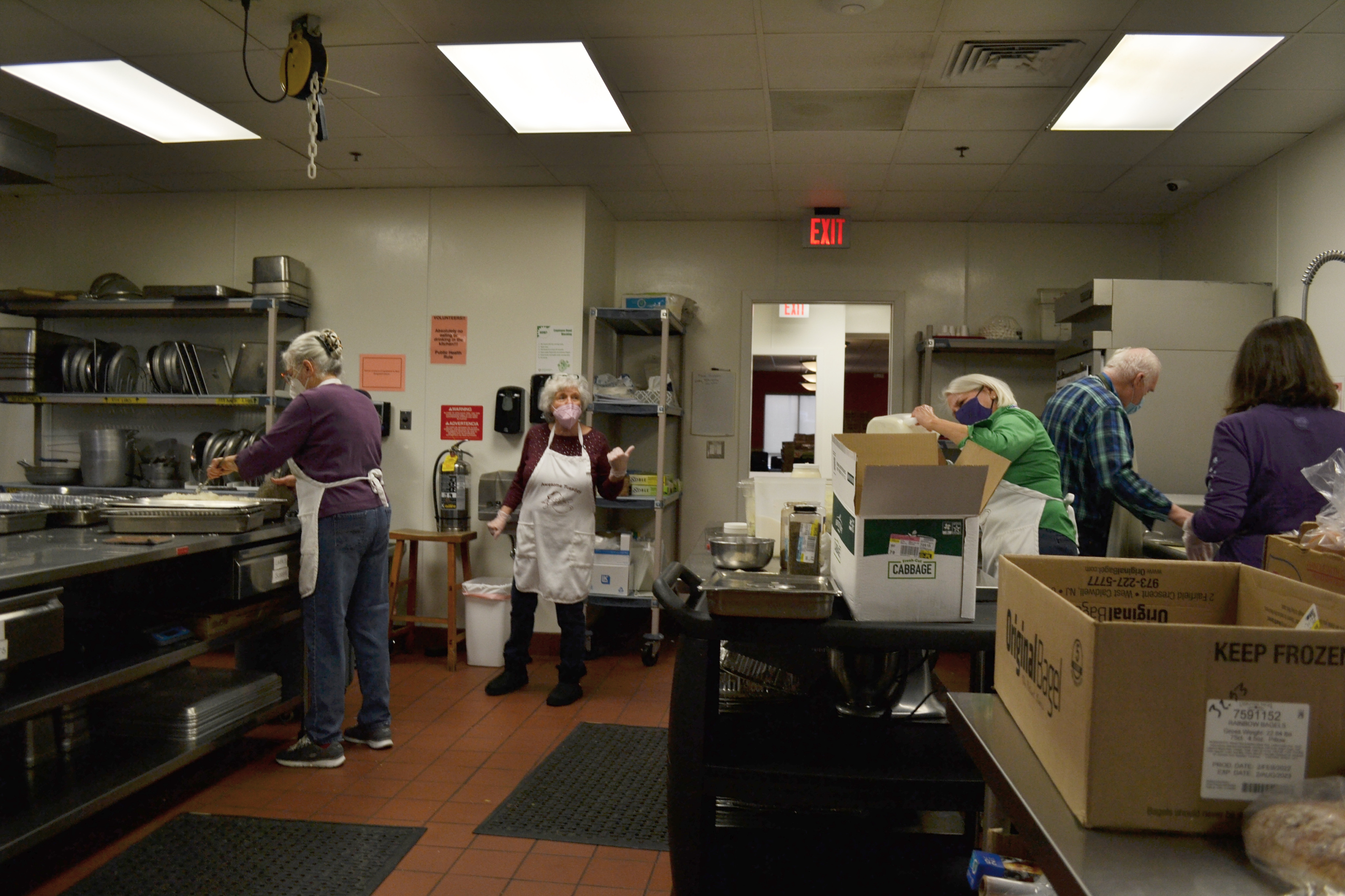 Inside the kitchen, many volunteers are working to prepare lunch for the Daily Bread Soup Kitchen. Photo by Alyssa Buckley.