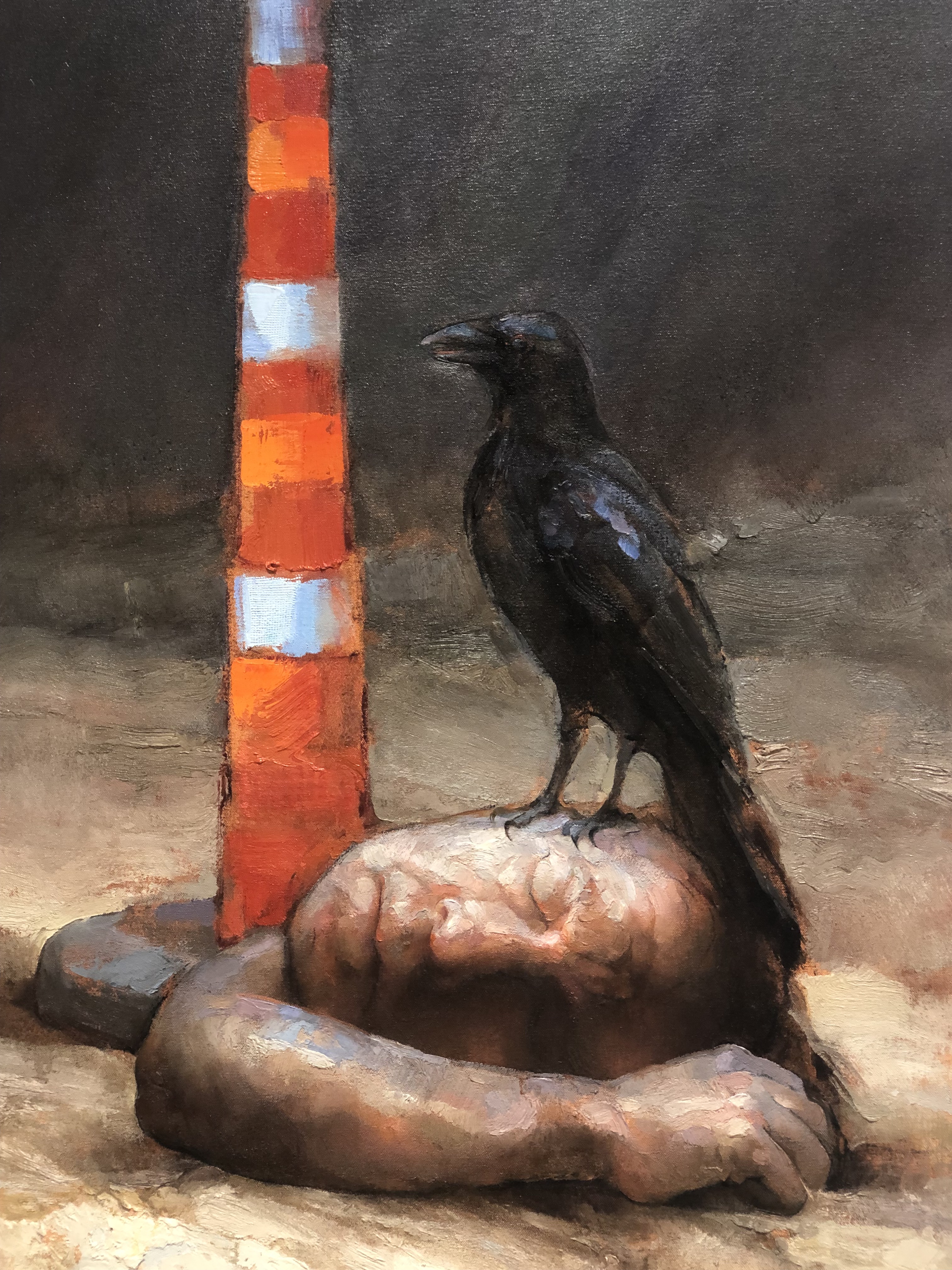 Dark background with disembodied head and arm beneath a raven. An orange and white safety cone stands next to the figures.