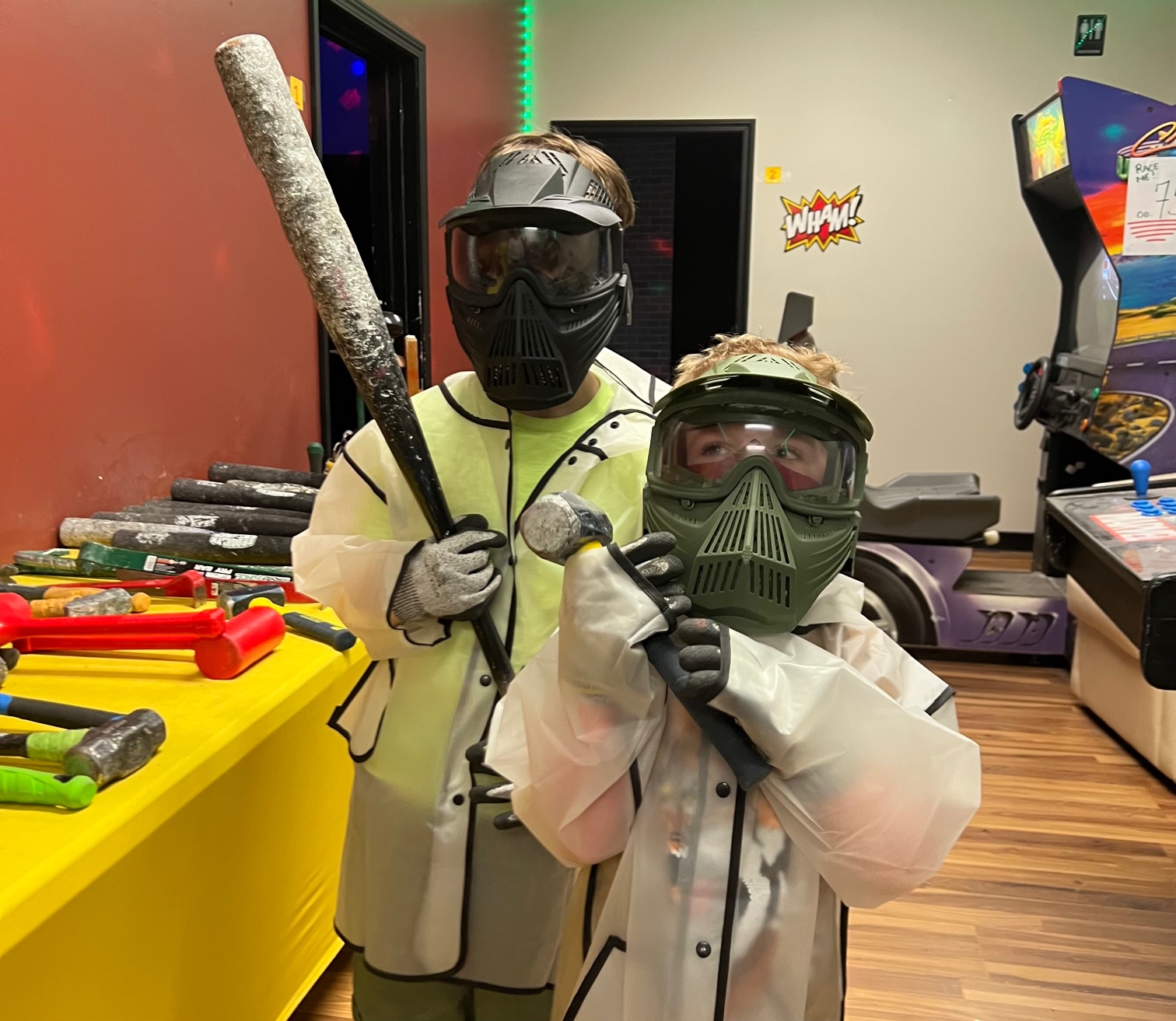 The author's two children are suited up for smashing things at Rage Room Champaign. Photo by Alyssa Buckley.