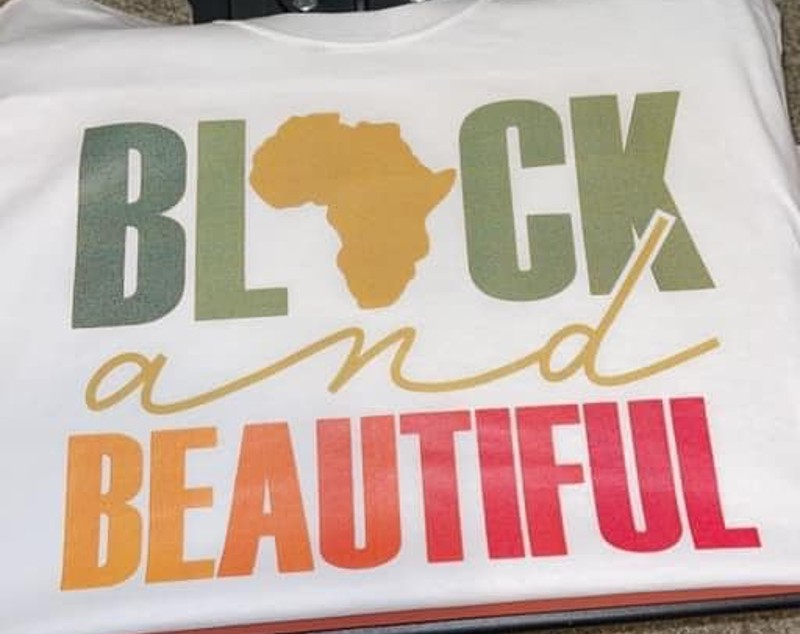 The front of a white t-shirt that says Black and Beautiful. The 