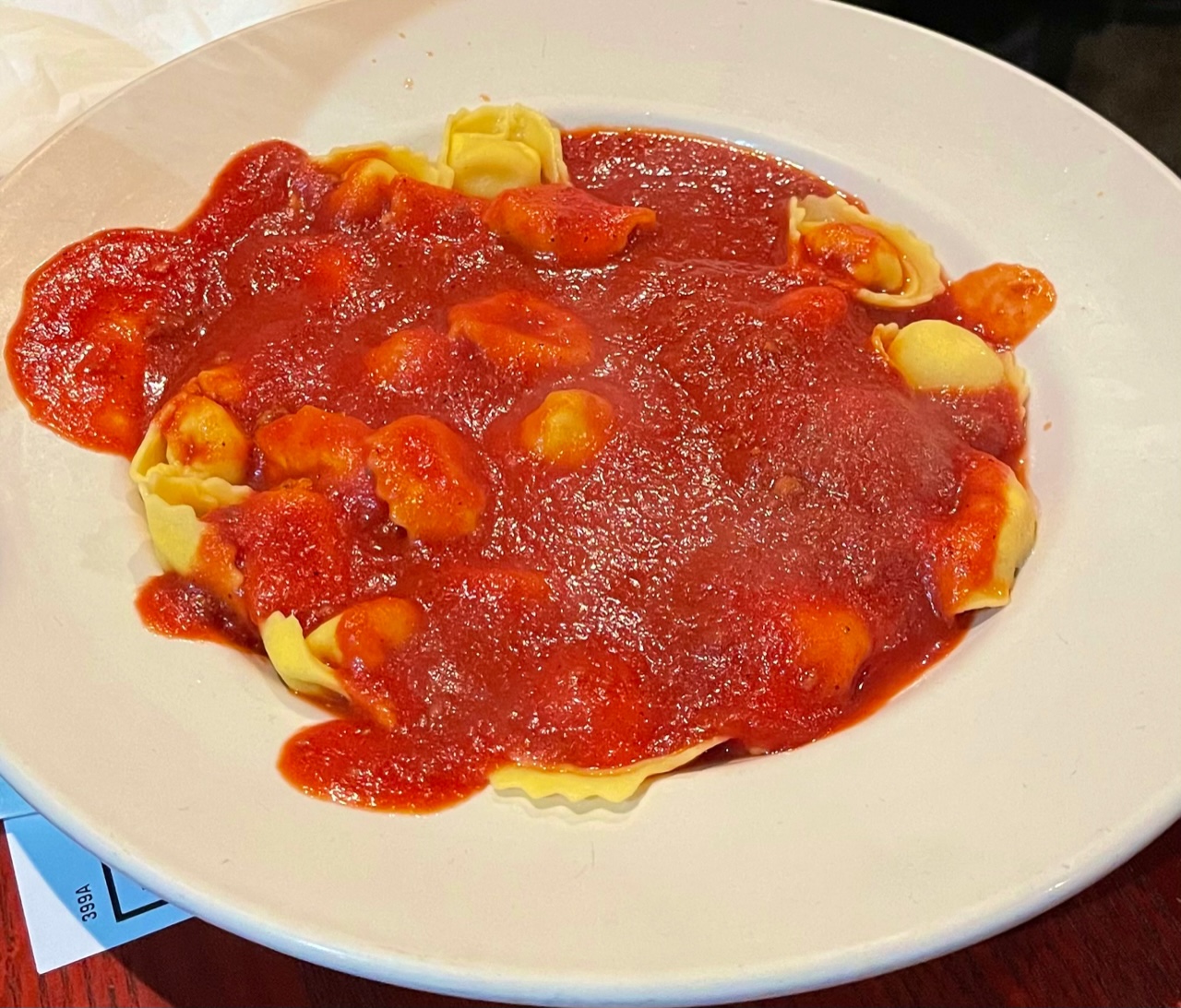 Filippo's order of tortellinni with meat sauce in a white bowl. Photo by Stephanie Wheatley.