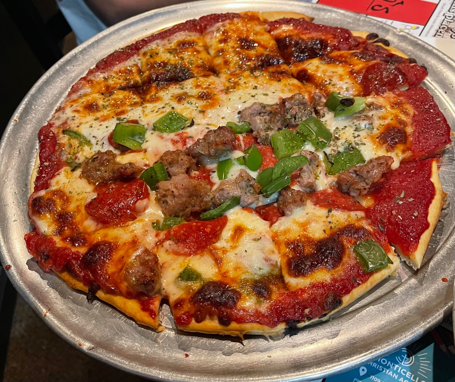 There is a full pizza pie on a metal pan for dine in at Filippo's. Photo by Stephanie Wheatley.